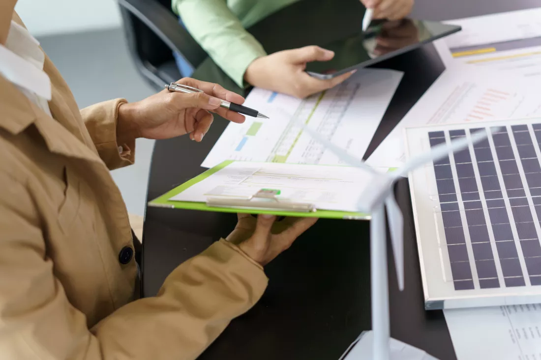 solar-panels-green-energy-business-people-working-green-eco-friendly-office-business-meeting