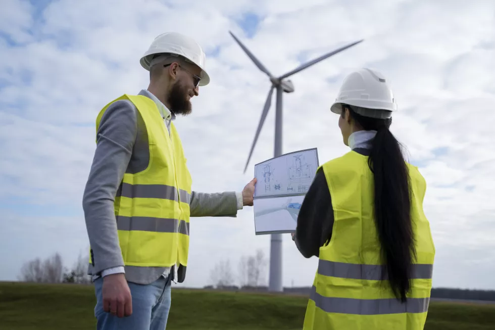 medium-shot-engineers-discussing-environmental-plan