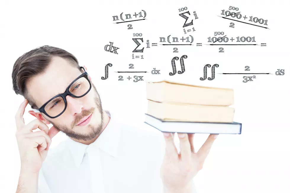 geeky-young-man-looking-pile-books-against-maths-equation