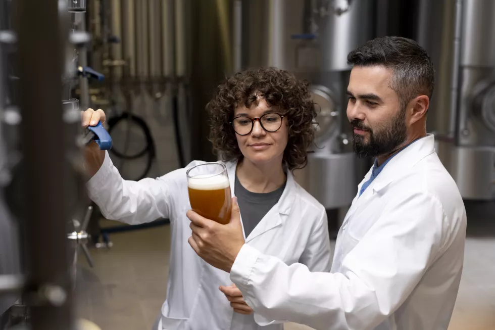 medium-shot-working-beer-factory