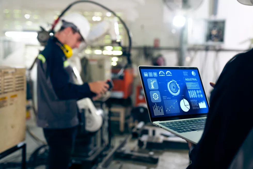 factory-workers-working-with-adept-robotic-arm-workshop(6)