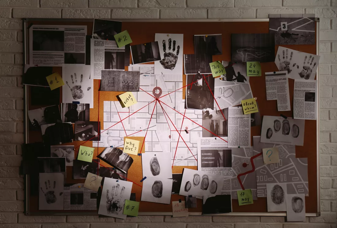 detective-board-with-fingerprints-photos-map-clues-connected-by-red-string-white-brick-wall
