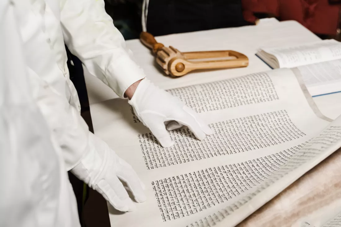rabbi-with-jewish-hebrew-bible-is-praying-israel-purim-celebration-rabbin-is-reading-tanakh-jewish-bible-grogger-noisemaker-purim