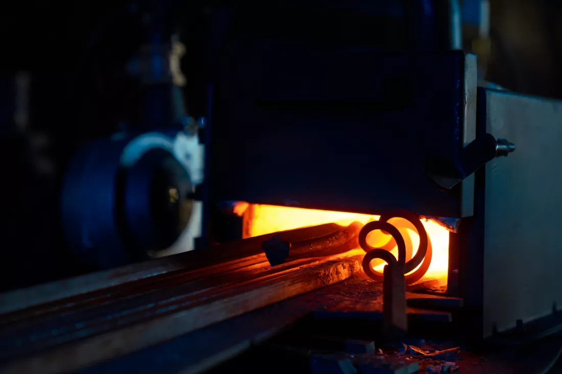 close-up-various-pieces-iron-heating-inside-forge-furnace-burning-fire-with-steel-preparation-metal-processing