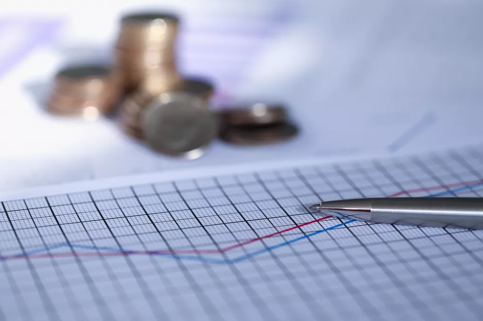 silver-pen-lies-report-with-graph-coin