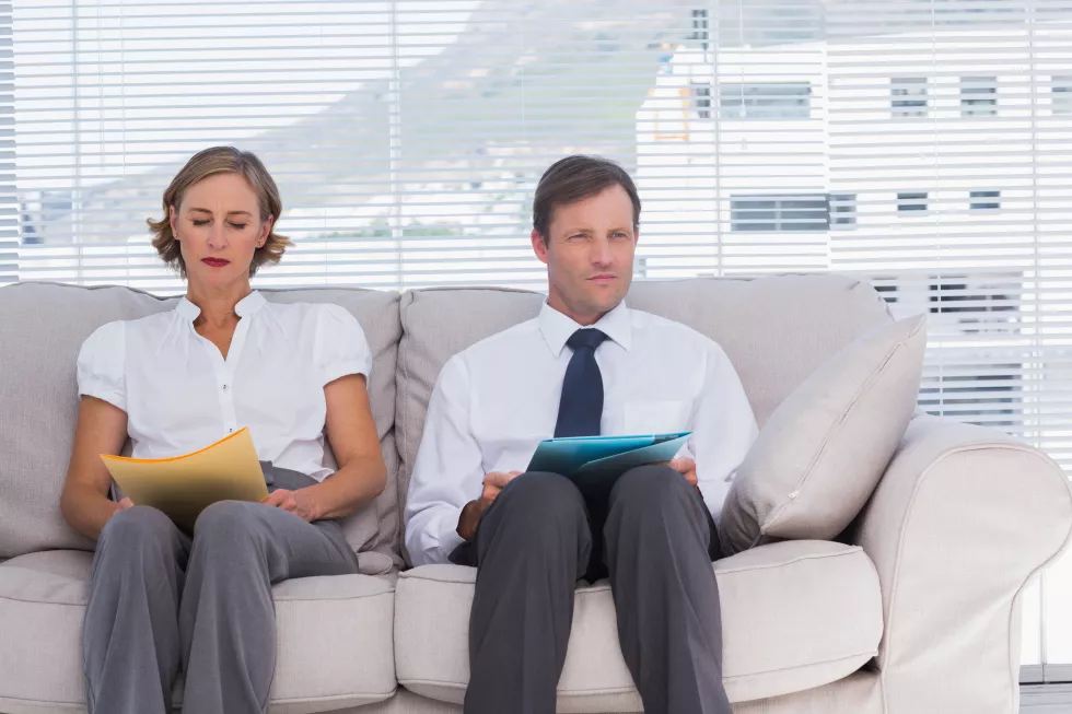 two-business-people-sitting-couch