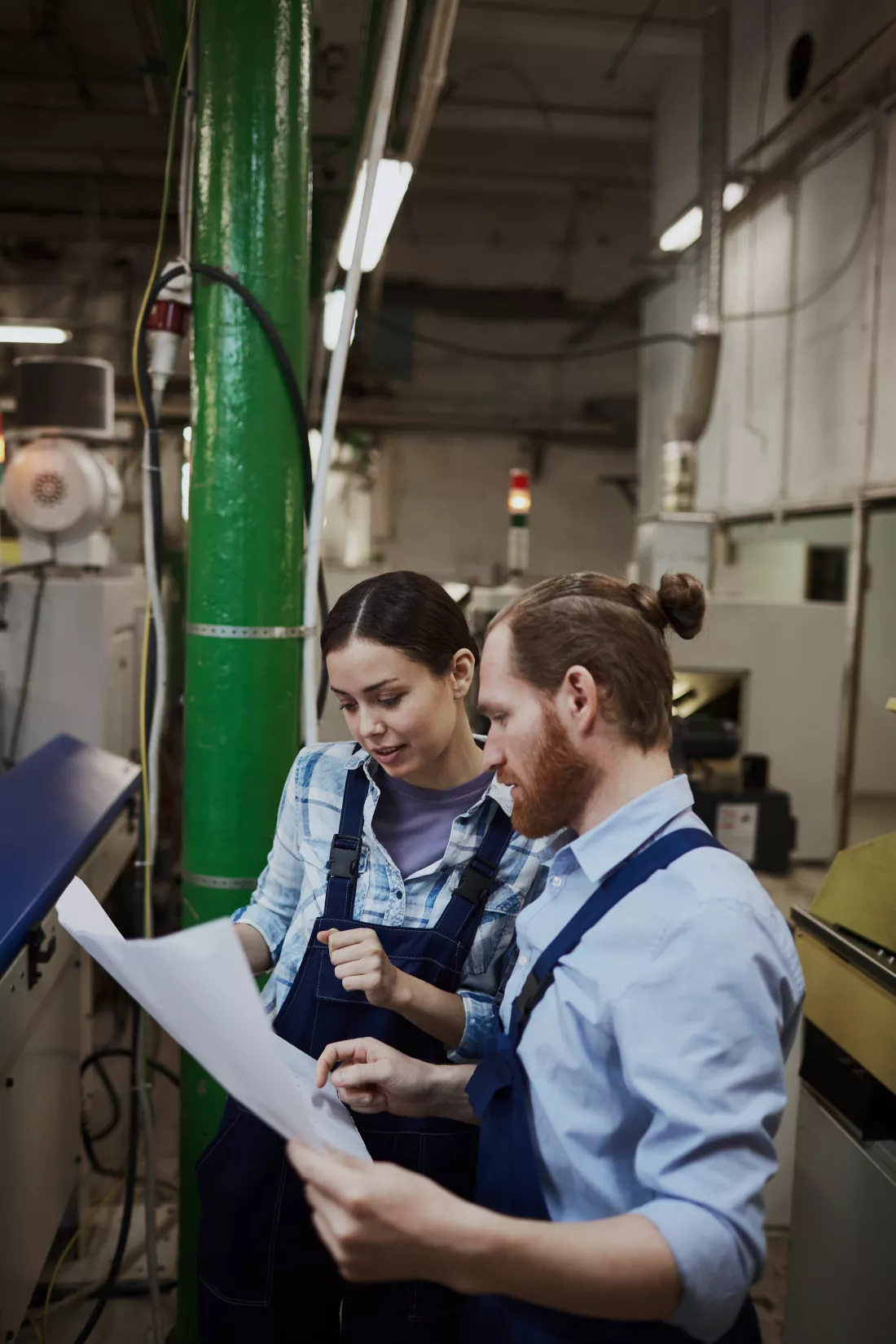 manual-workers-examining-blueprint
