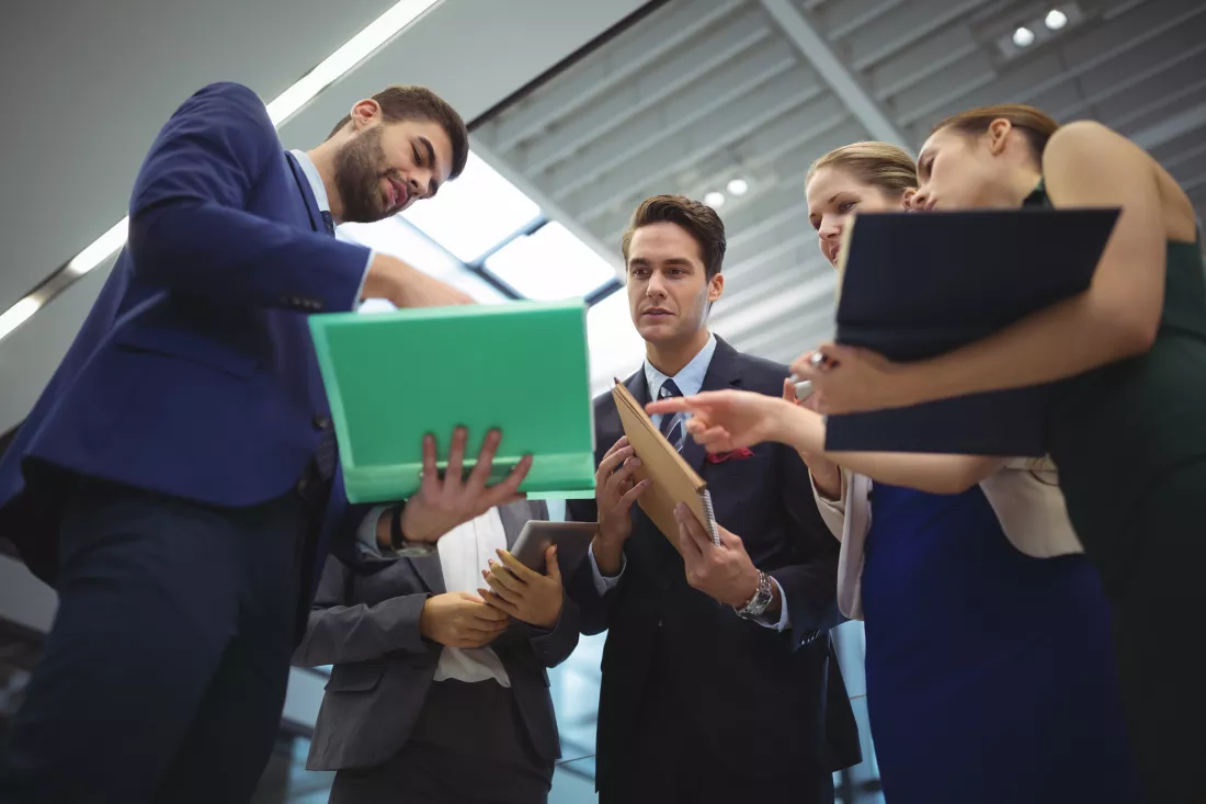 business-executives-discussing-reports