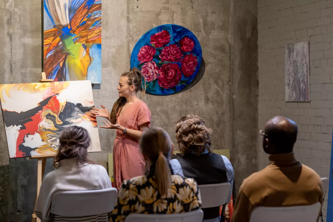 woman-presenting-modern-art-people