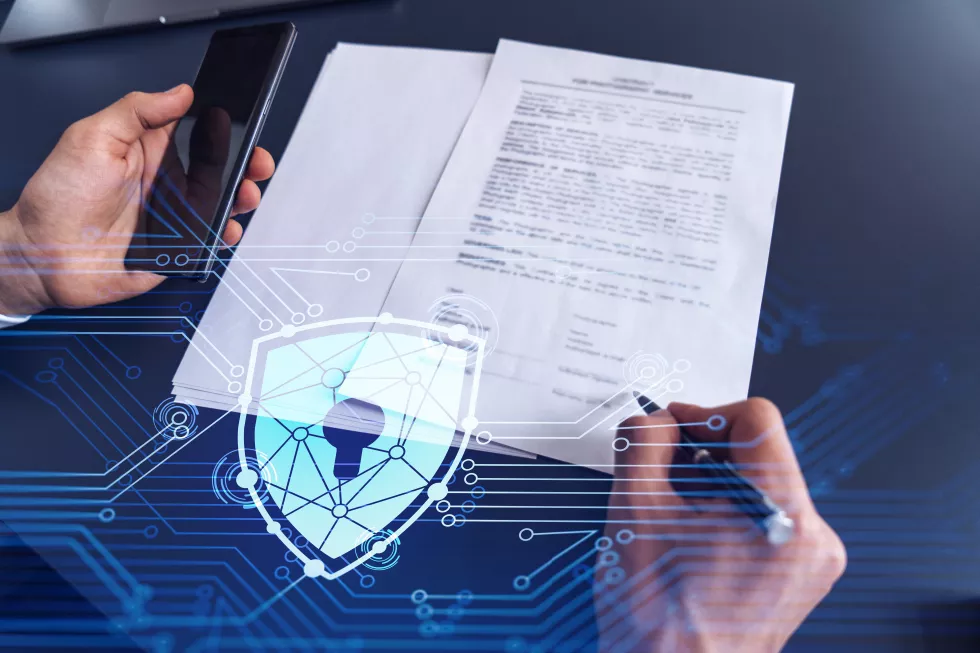 businessman-formal-wear-signing-contract-prevent-probability-risks-cyber-security-padlock-hologram-icons-working-desk(1)