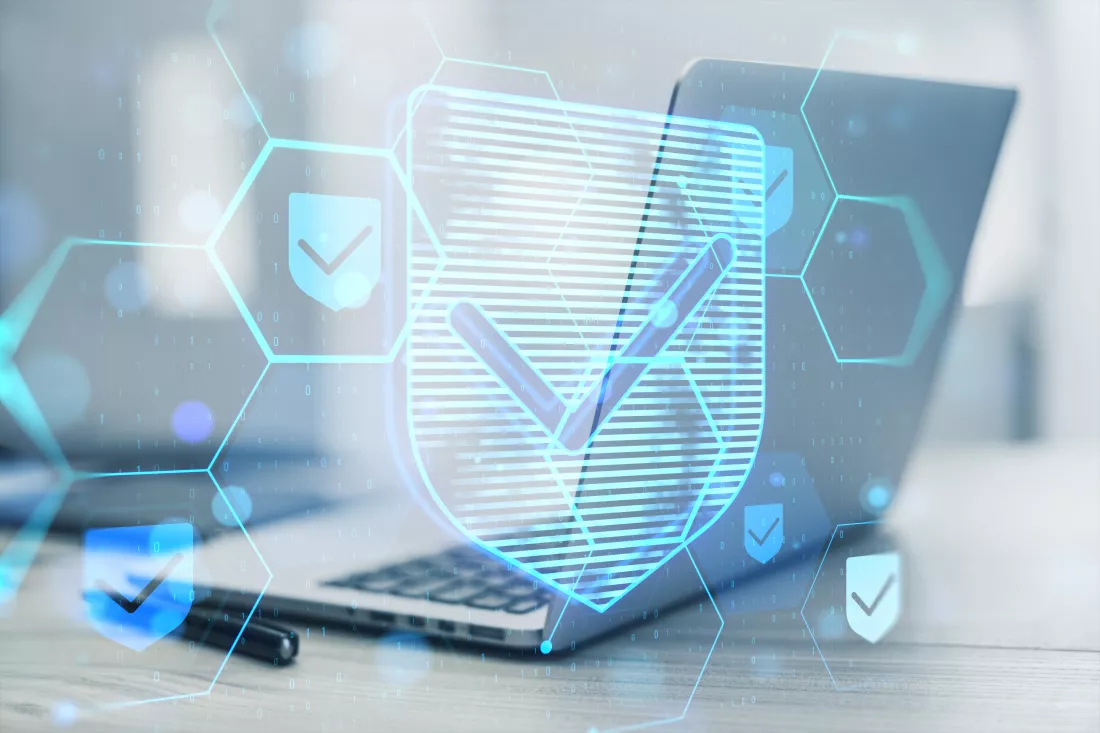 close-up-laptop-computer-desk-with-glowing-hexagonal-shield-hologram-binary-coding-blurry-background-safety-internet-concept-double-exposure