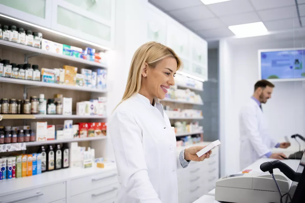 female-caucasian-pharmacist-selling-medicines-pharmacy-store
