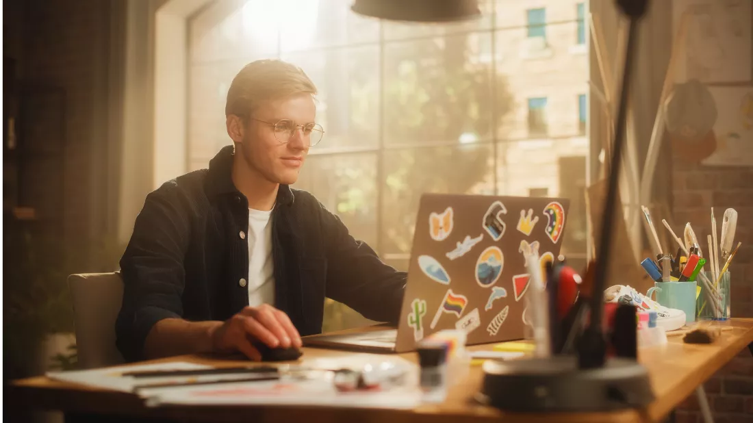 concentrated-man-designs-video-game-his-powerful-laptop-computer-creative-office-space-man-looking-screen-creating-digital-clothing-footwear-metaverse