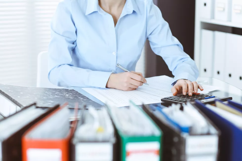 bookkeeper-woman-financial-inspector-making-report-calculating-checking-balance-close-up-business-audit-tax-concepts