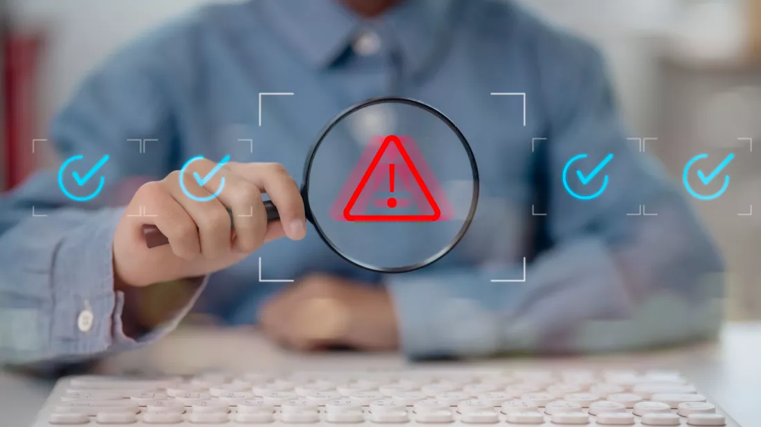 man-holding-magnifying-glass-is-warning-alert-error-security-breach-something-is-wrong-compliance-problem-is-detected