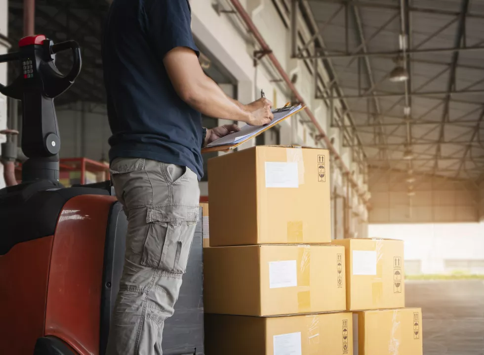 worker-is-doing-inventory-management-warehouse-shipment-boxes-check-stock
