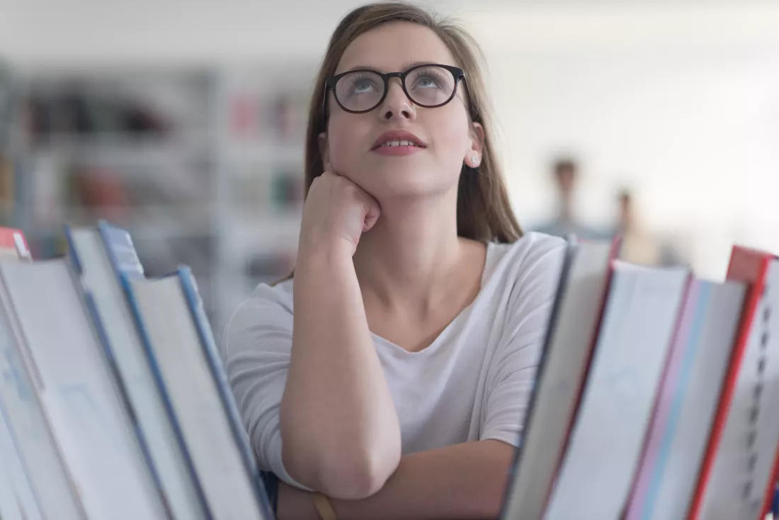 portrait-smart-looking-famale-student-girl-collage-school-library-selecting-book-read-from-bookshelf