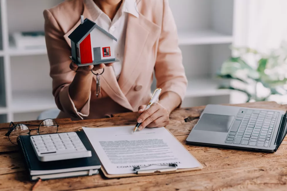 real-estate-broker-agent-presenting-consult-customer-decision-making-sign-insurance-form-agreement-buy-sell-home-model-concerning-mortgage-loan-offer-house-insurance