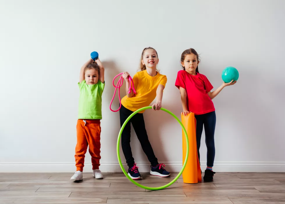 sportive-kids-colorful-tshirts-posing-with-sport-equipment