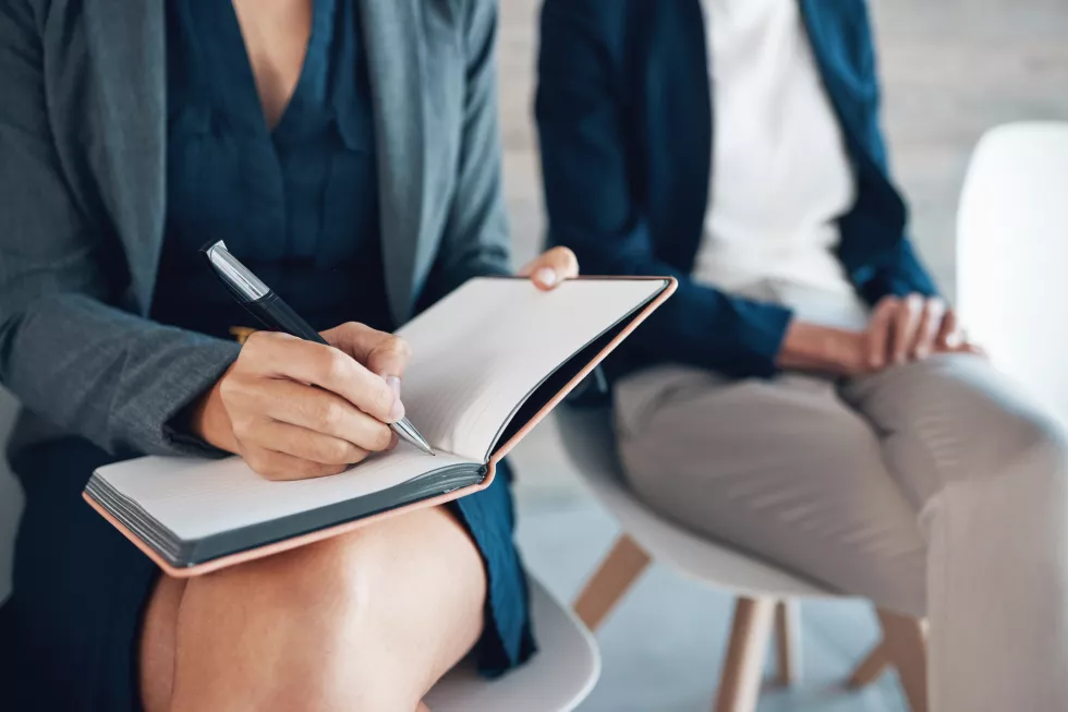 woman-notebook-writing-job-interview-notes-waiting-room-candidates-opportunity-female-person-schedule-diary-appointments-company-planning-journal-with-coworkers