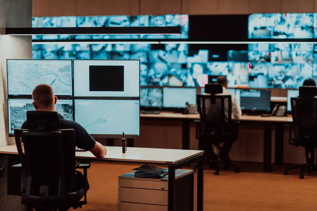 male-security-operator-working-data-system-control-room-offices-technical-operator-working-workstation-with-multiple-displays-security-guard-working-multiple-monitors-male-computer-opera