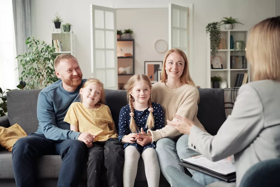 social-worker-talking-adoptive-family-home(1)