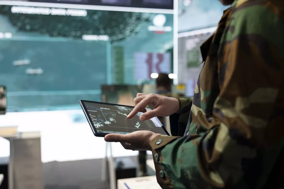 army-recruit-examines-satellite-reconnaissance-system-world-map