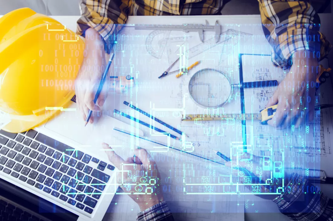 two-colleagues-discussing-data-working-tablet-laptop-with-architectural-project-construction-site-desk-office