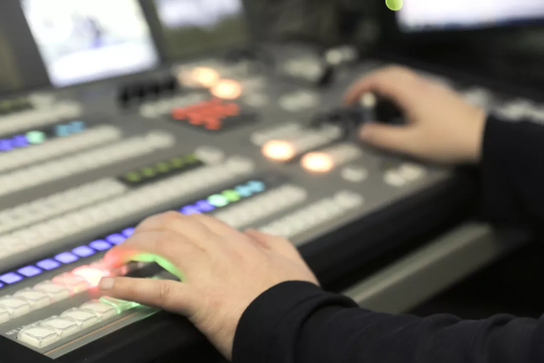 cropped-hands-mixing-music-recording-studio