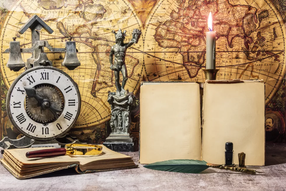still-life-wind-up-clock-antique-books-vintage-world-map
