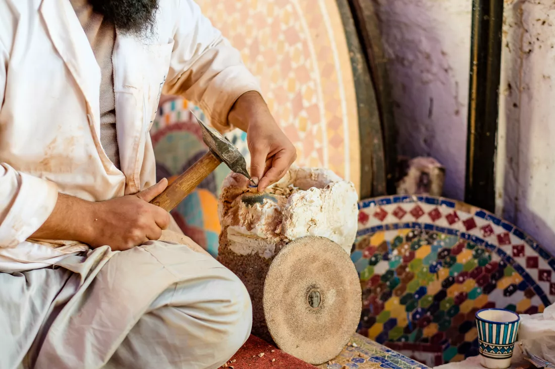 midsection-man-carving-wood-workshop