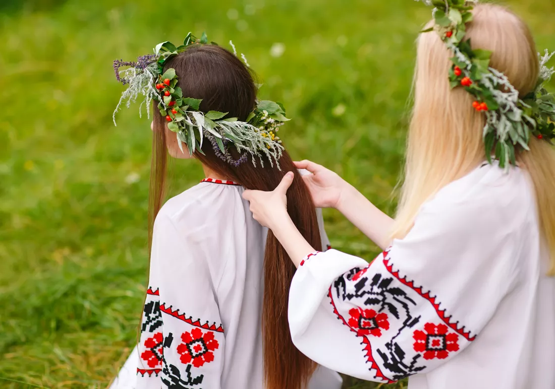 midsummer-two-girls-slavic-clothes-weave-braids-hair-near-fire