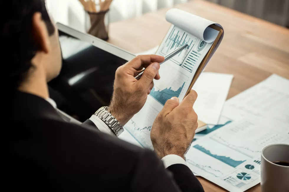 group-business-analyst-team-analyzing-financial-data-report-meticulous