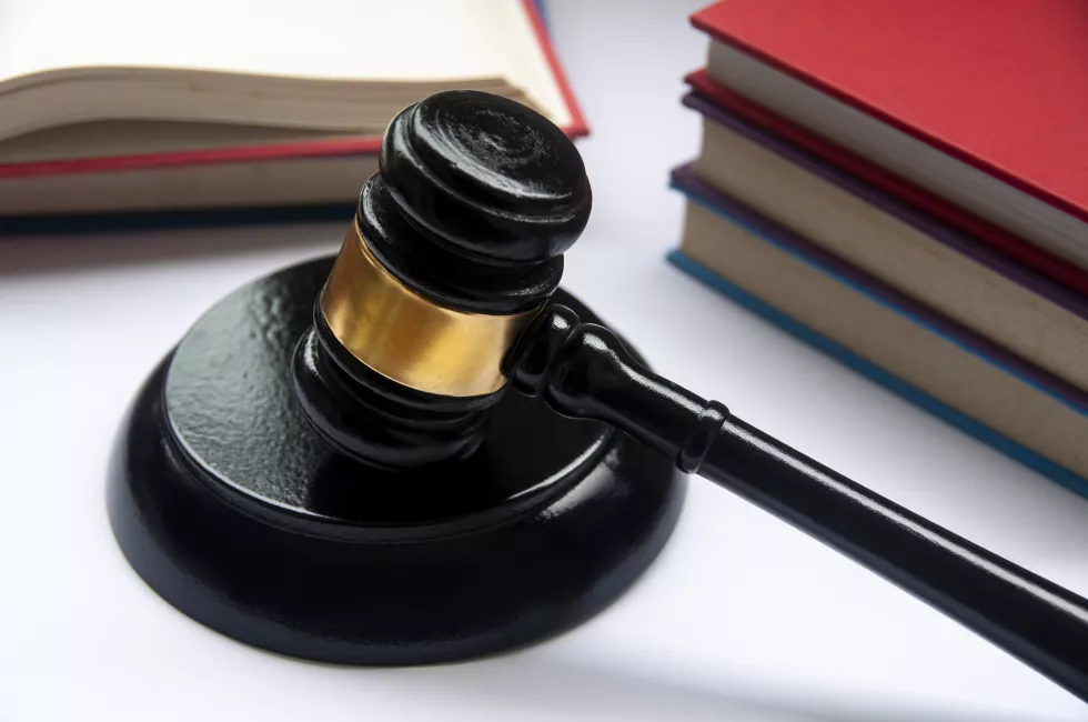 lawyer-gavel-white-cover-with-books-background-law-concept