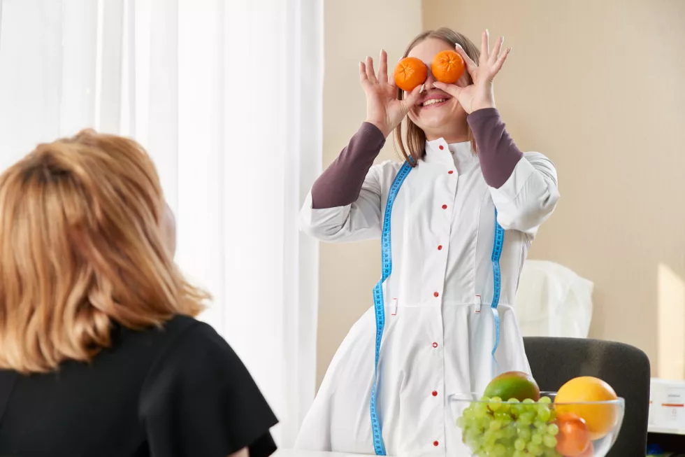 young-girl-visiting-nutritionist-lose-weight-with-help-diet-program