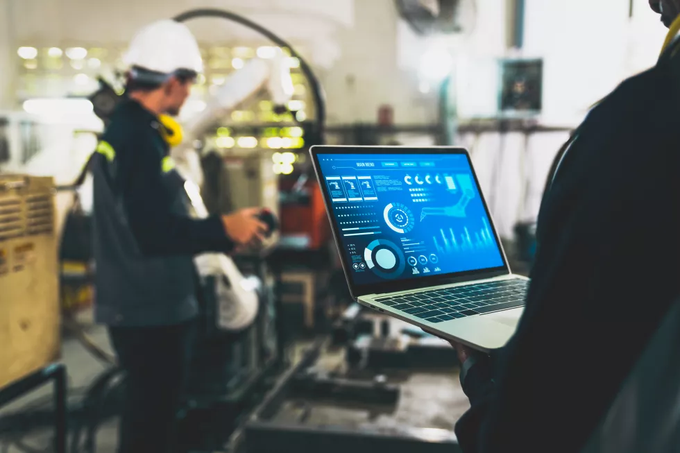 factory-workers-working-with-adept-robotic-arm-workshop(4)