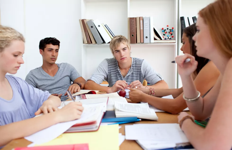 teenagers-studying-library