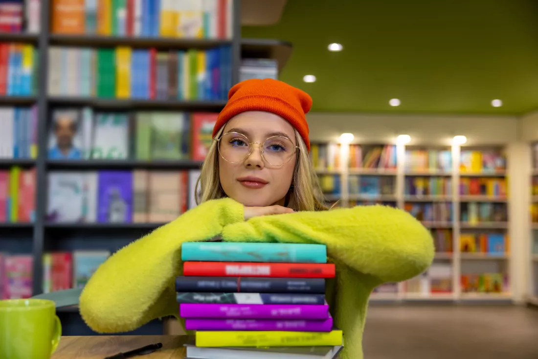 library-young-cute-woman-looking-camera-ii-library