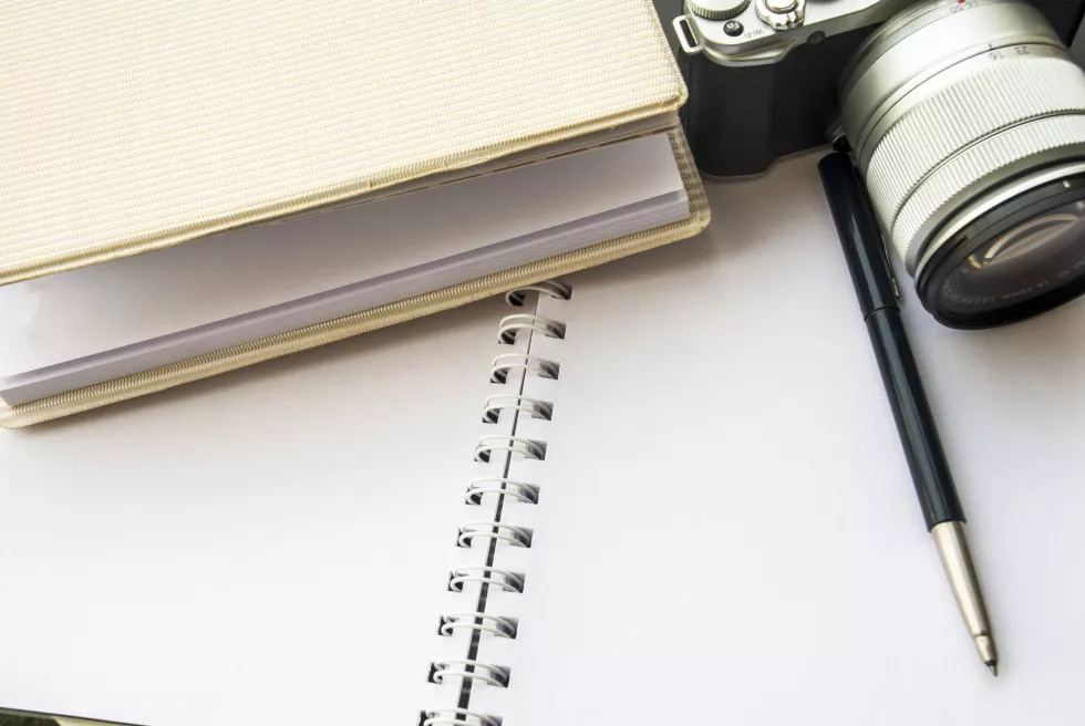 high-angle-view-pen-camera-book