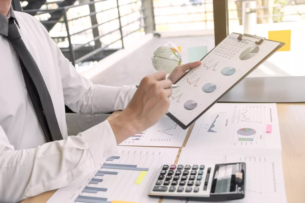 midsection-businessman-working-table