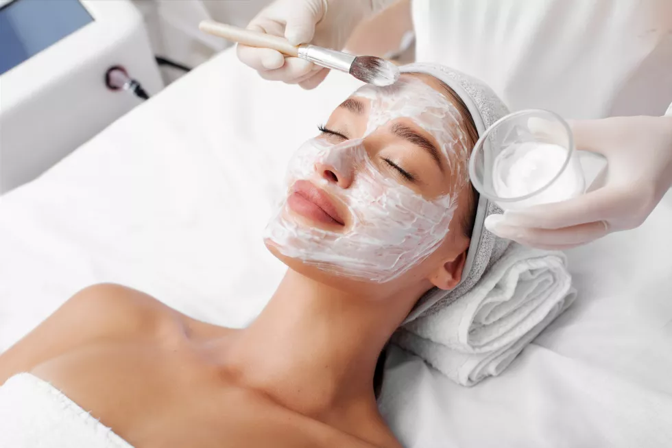 beautiful-european-lady-enjoying-receiving-cosmetic-nourishing-mask-relaxing-treatment-spa-center