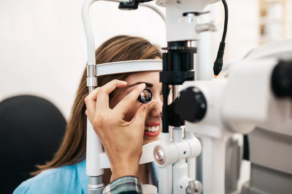 female-optometrist-checking-patient-s-vision-eye-clinic-healthcare-medical-concept