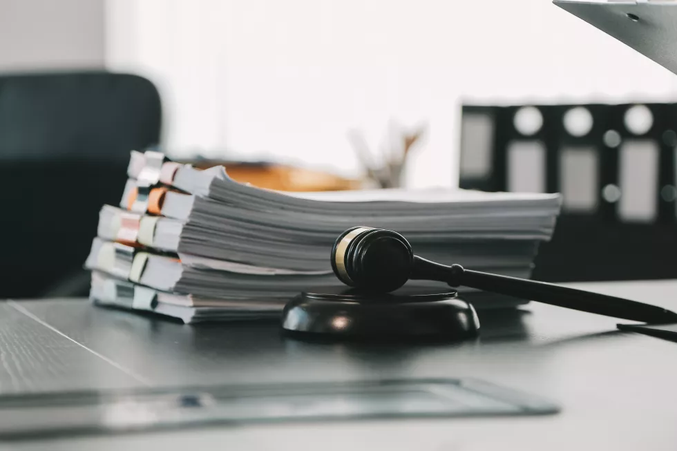 business-lawyers-discussing-contract-papers-with-brass-scale-desk-office-law-legal-services-advice-justice-law-concept-picture-with-film-grain-effect