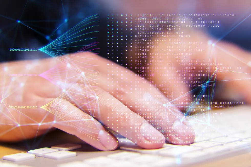 hand-typing-keyboard-with-digital-network-binary-code-overlay-symbolizing-technology-data-processing-bokeh-background