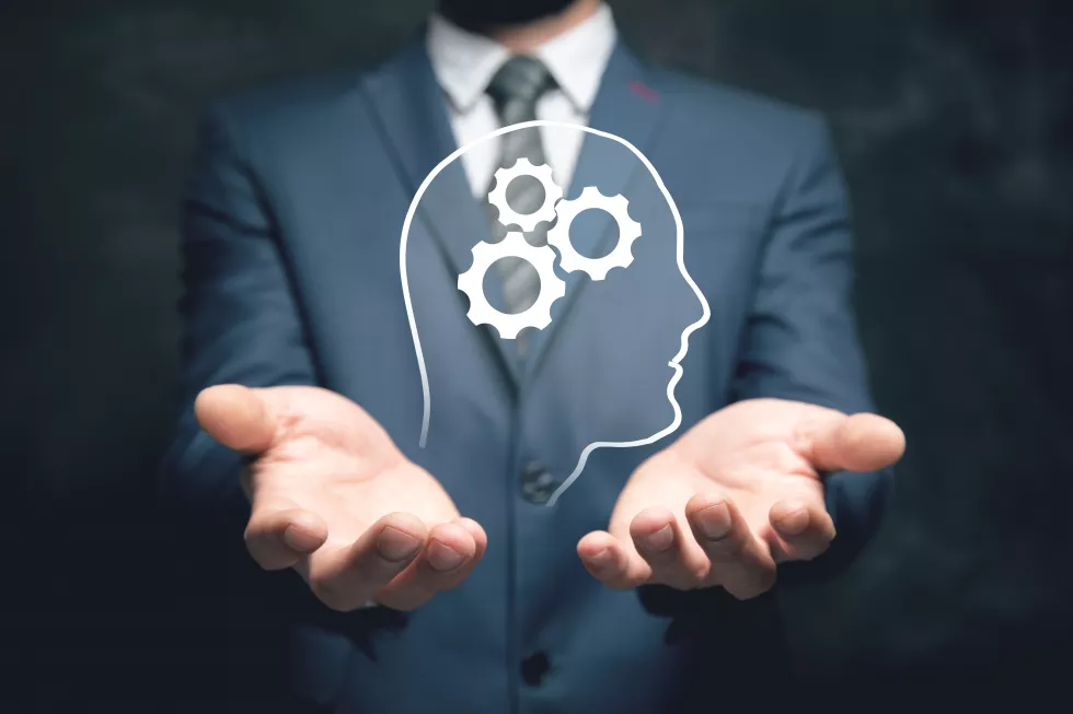 illustrated-human-head-has-gear-man-holding-his-hand