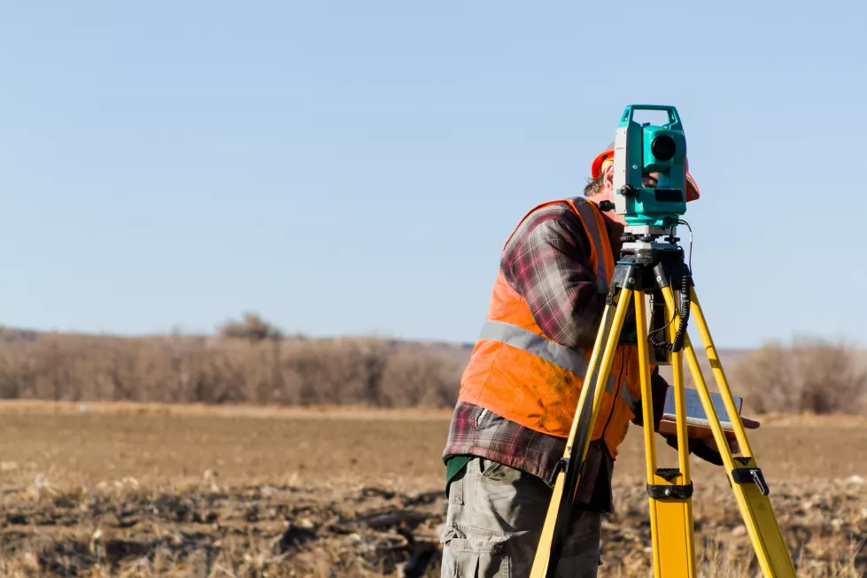 land-surveyors-measuring-existing-railroad-bridge-rural-area