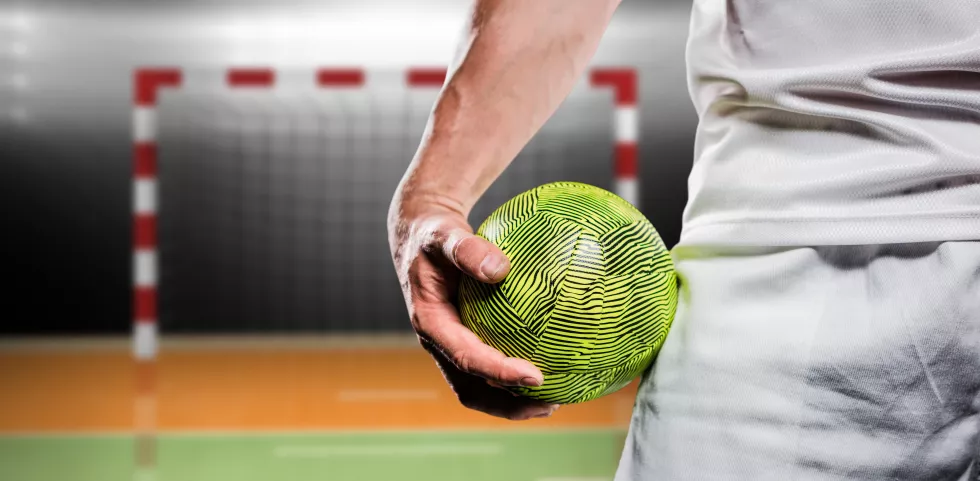 composite-image-sportsman-holding-ball
