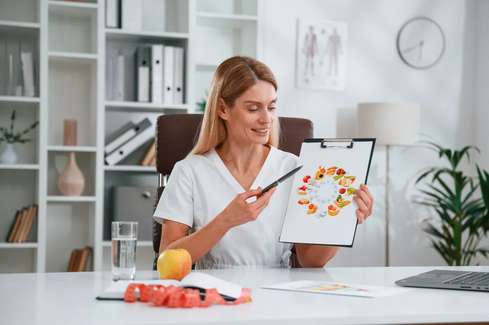with-picture-food-vitamins-young-female-doctor-white-coat-is-indoors