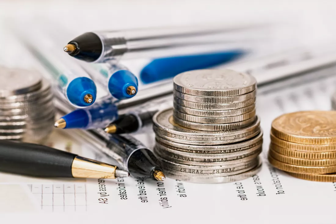 coins-pencils-showing-financial-success-education