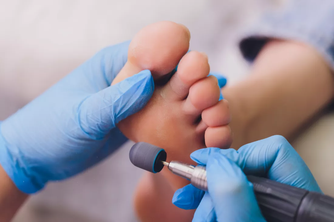process-pedicure-close-up-polishing-feet-unrecognizable-people-blurred-face